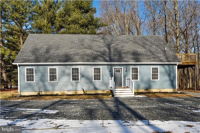 view of front of house featuring crawl space and a shingled roof