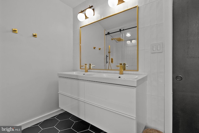 bathroom featuring tile patterned flooring, vanity, and walk in shower