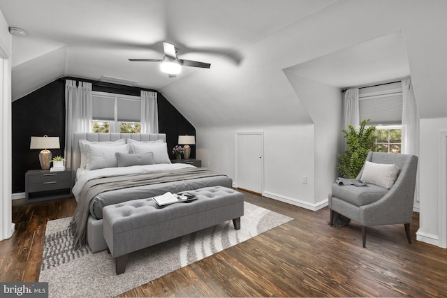 bedroom with vaulted ceiling, dark hardwood / wood-style floors, and ceiling fan