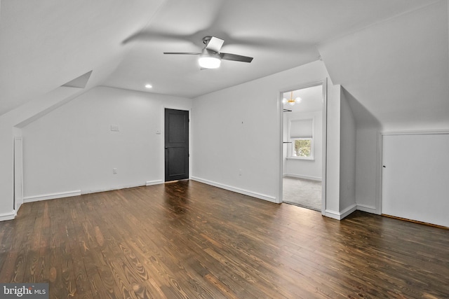 additional living space featuring ceiling fan, lofted ceiling, and dark hardwood / wood-style flooring