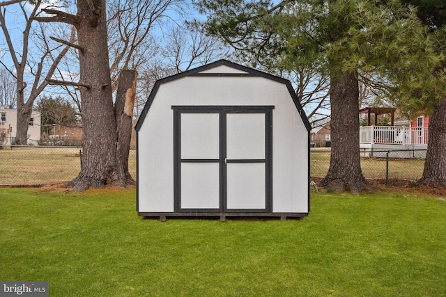 view of outbuilding featuring a lawn