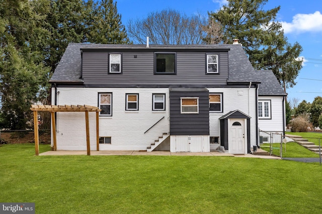 back of property featuring a patio, a yard, and a pergola