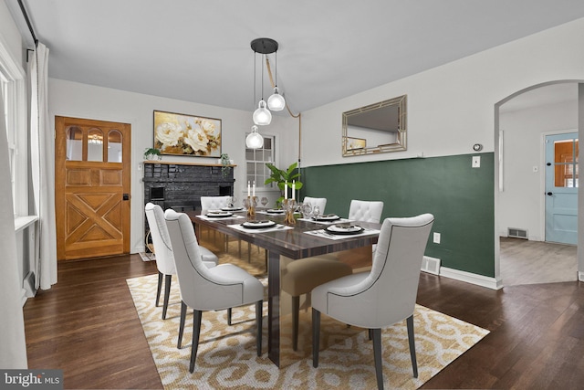 dining area with dark hardwood / wood-style floors