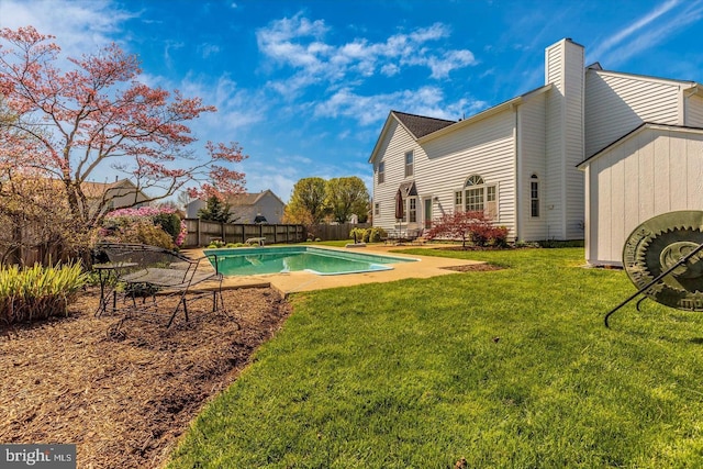 view of yard featuring a fenced in pool and a patio area