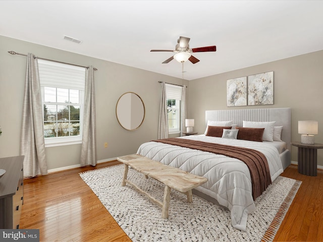 bedroom featuring light hardwood / wood-style flooring and ceiling fan