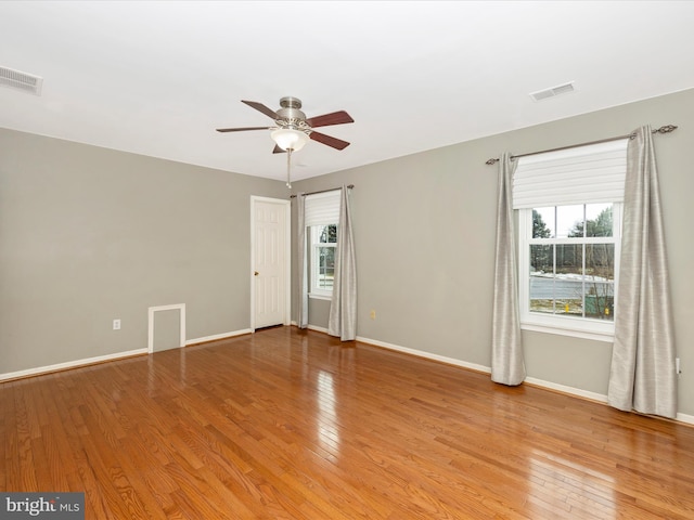 unfurnished room featuring light hardwood / wood-style flooring and ceiling fan