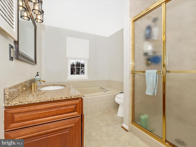 full bathroom with vanity, toilet, and separate shower and tub