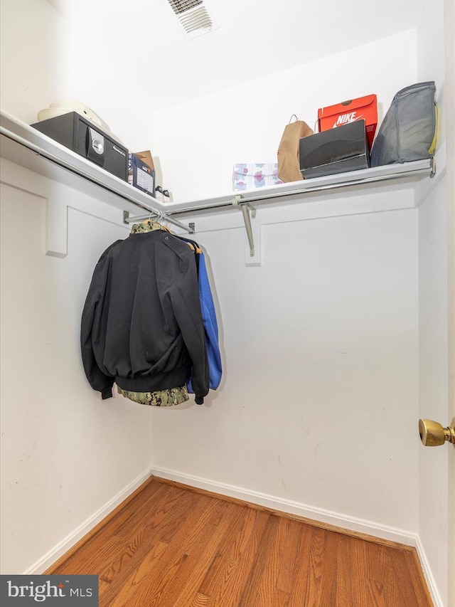 spacious closet featuring hardwood / wood-style floors