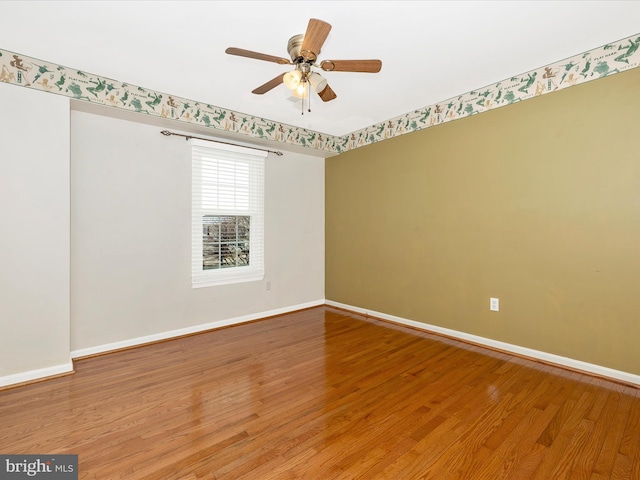 unfurnished room featuring hardwood / wood-style floors and ceiling fan