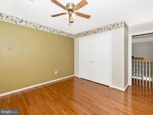 unfurnished bedroom with wood-type flooring and ceiling fan