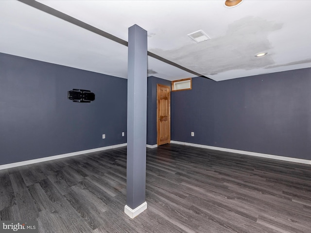 basement featuring dark hardwood / wood-style floors