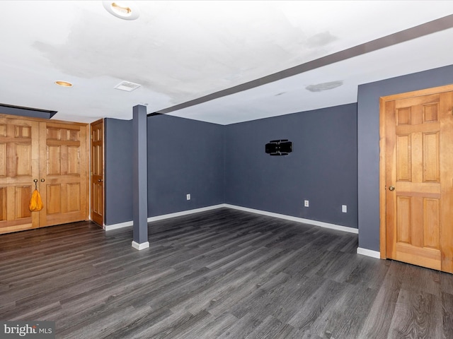 basement featuring dark wood-type flooring