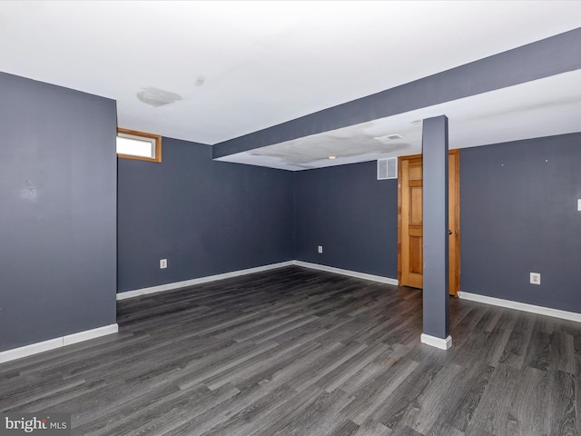 basement featuring dark hardwood / wood-style floors