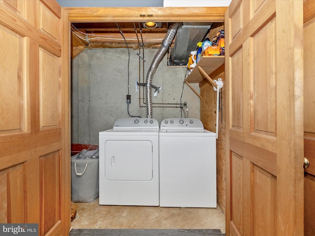 laundry area with washing machine and dryer