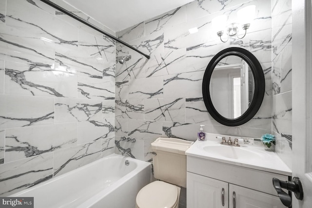 full bath featuring toilet, bathtub / shower combination, tile walls, and vanity