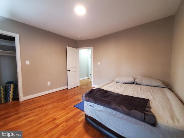 bedroom with wood-type flooring