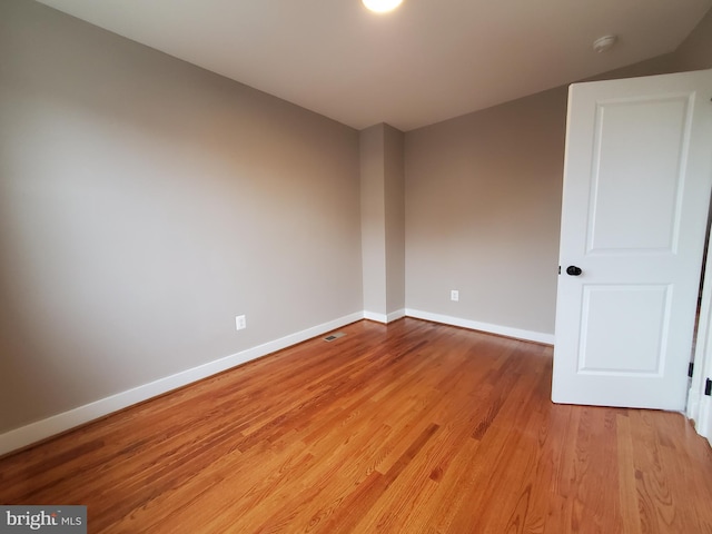 spare room with light wood-type flooring