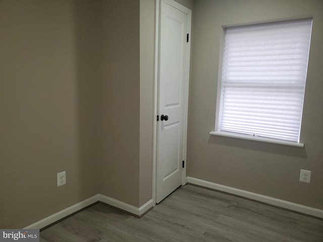 unfurnished room with light hardwood / wood-style flooring