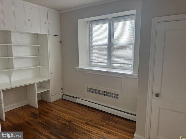 interior space featuring dark wood finished floors, visible vents, a baseboard heating unit, and ornamental molding