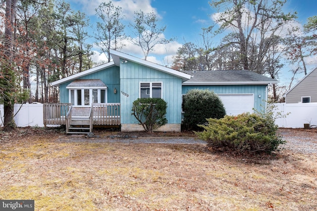 view of front of house featuring a wooden deck and a garage