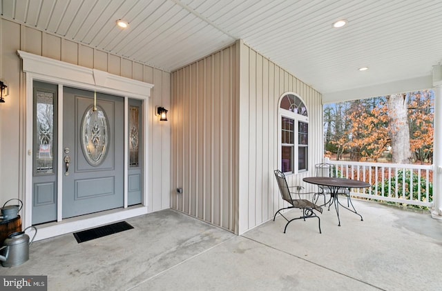 view of exterior entry with a porch