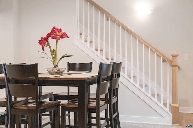 dining space featuring wood-type flooring