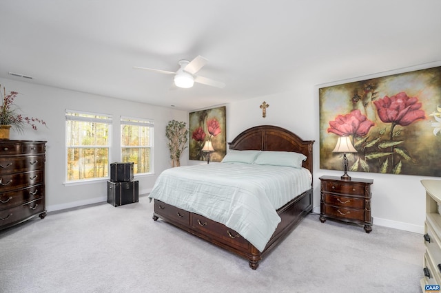 bedroom featuring light carpet and ceiling fan