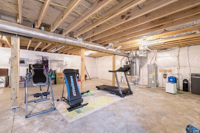 workout area featuring water heater and electric water heater