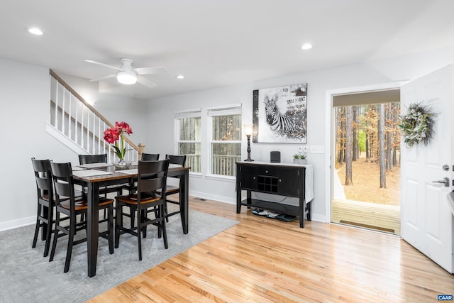 dining area featuring ceiling fan, light hardwood / wood-style floors, and a wealth of natural light