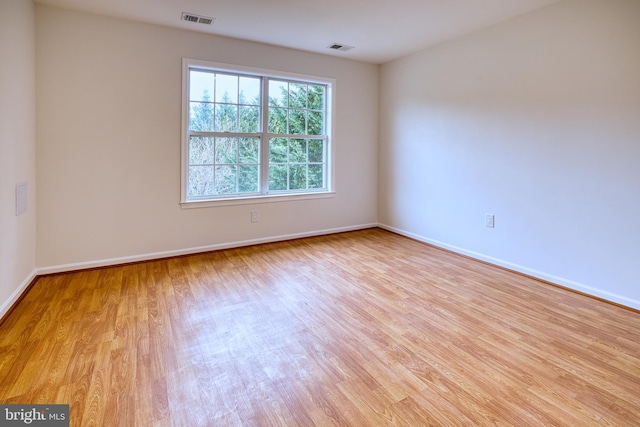 unfurnished room featuring light hardwood / wood-style flooring