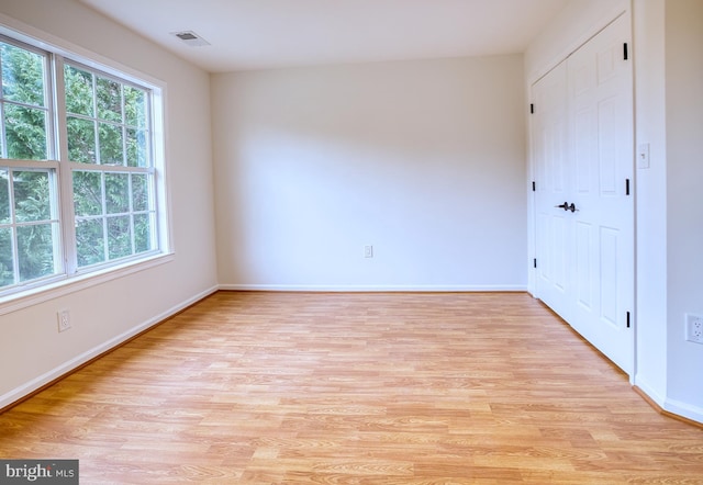 spare room with light hardwood / wood-style floors