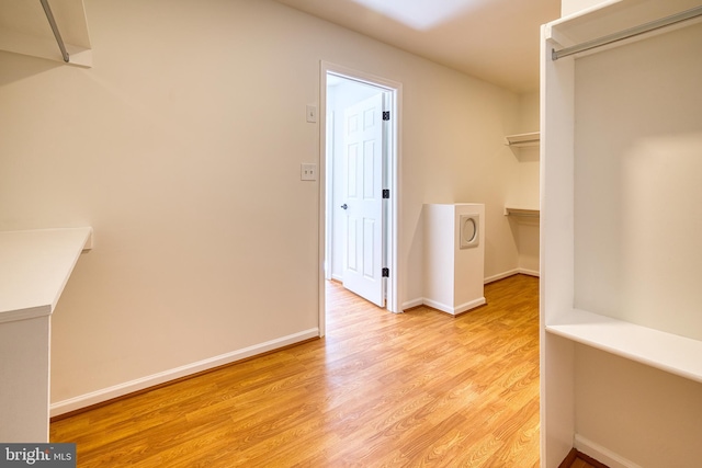 walk in closet featuring light hardwood / wood-style floors