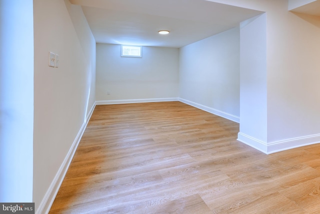 basement featuring light hardwood / wood-style floors