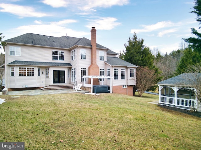 back of house featuring a pergola, a yard, a gazebo, and a patio area