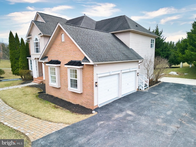 view of side of property with a garage