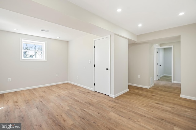 basement featuring light wood-type flooring