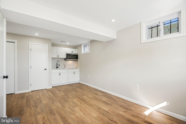 interior space with sink and light hardwood / wood-style floors