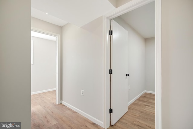 corridor with light wood-type flooring