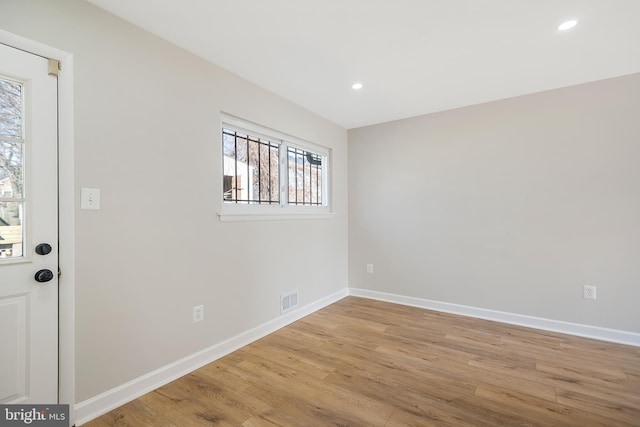 spare room with light wood-type flooring