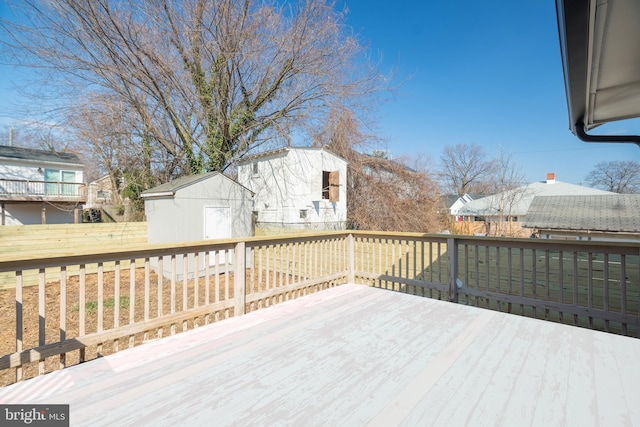deck with a storage shed