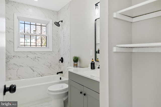 full bathroom featuring vanity, toilet, and tiled shower / bath combo
