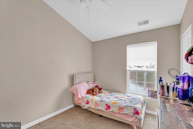 bedroom with carpet and lofted ceiling