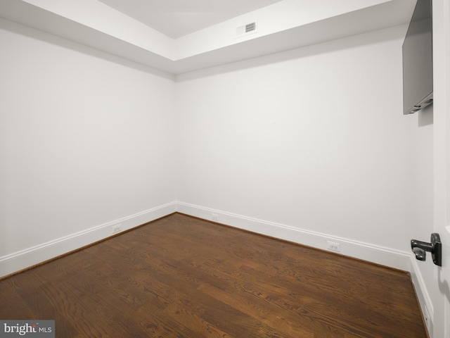 empty room featuring dark wood-type flooring