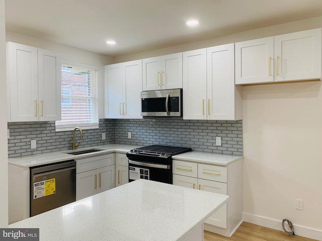 kitchen with white cabinets and dishwashing machine