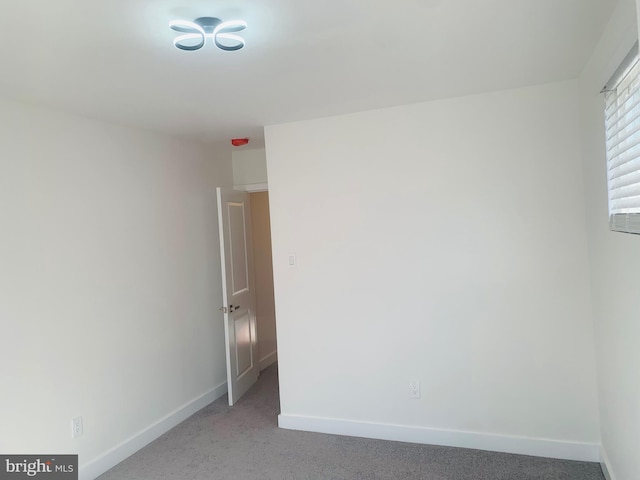 empty room featuring carpet flooring