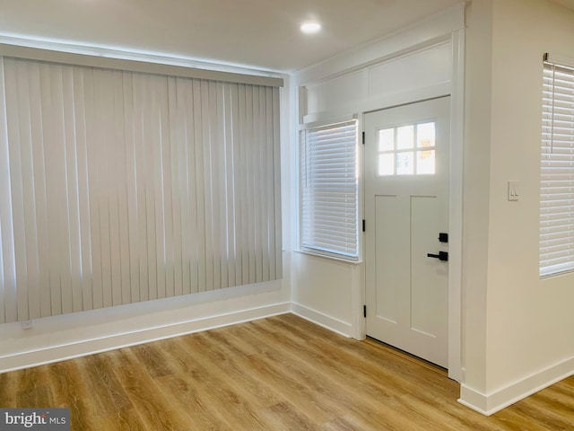 foyer with light hardwood / wood-style floors