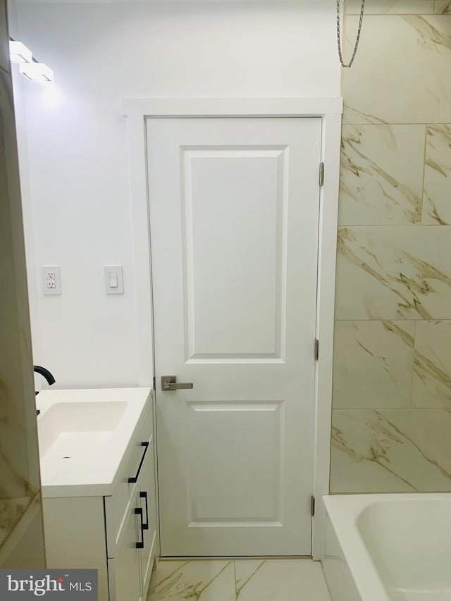 bathroom featuring vanity and tub / shower combination