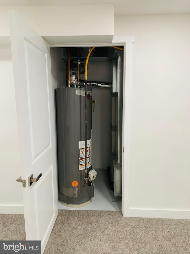 utility room featuring gas water heater