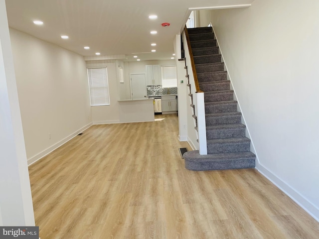 unfurnished living room with light wood-type flooring