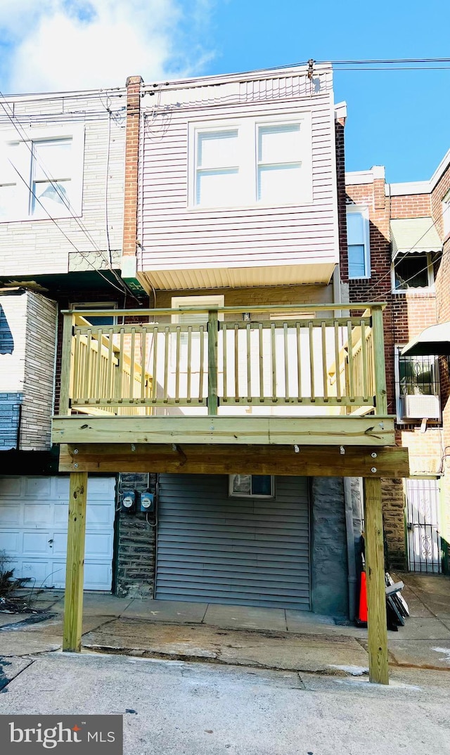 back of house featuring a balcony